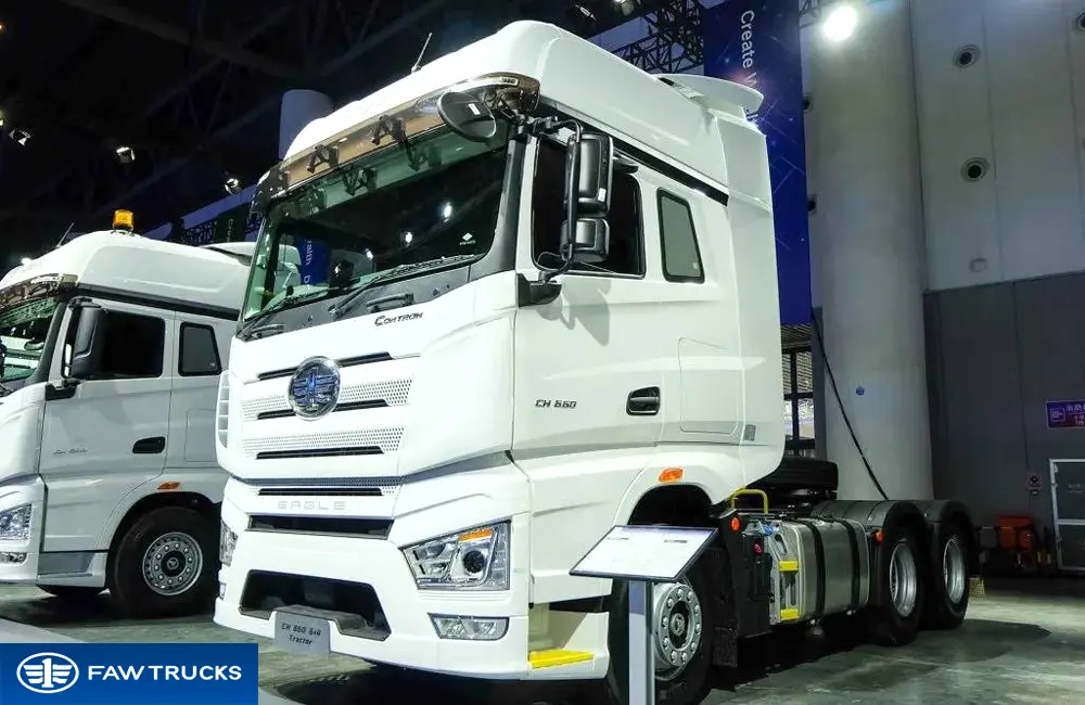 White CORTRON CH 660 6x4 tractor truck with FAW logo, EAGLE grille badge, and CH 660 side badge, displayed at an exhibition.