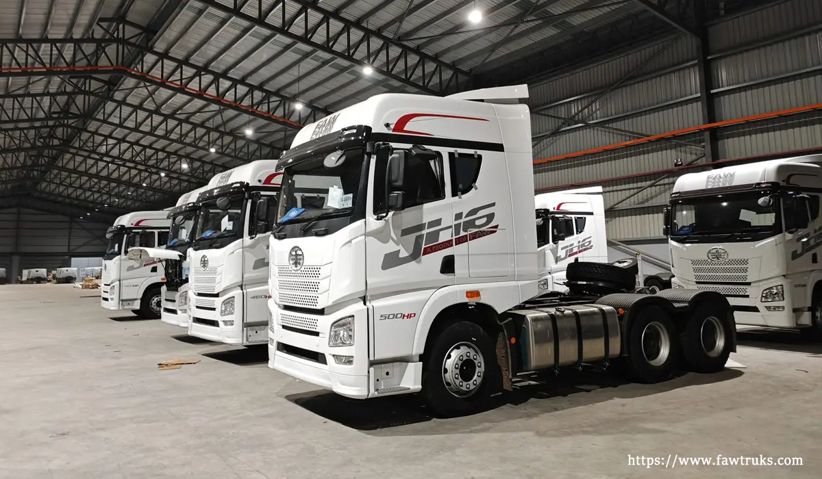 FAW JH6 500HP truck tractor with red decals in warehouse