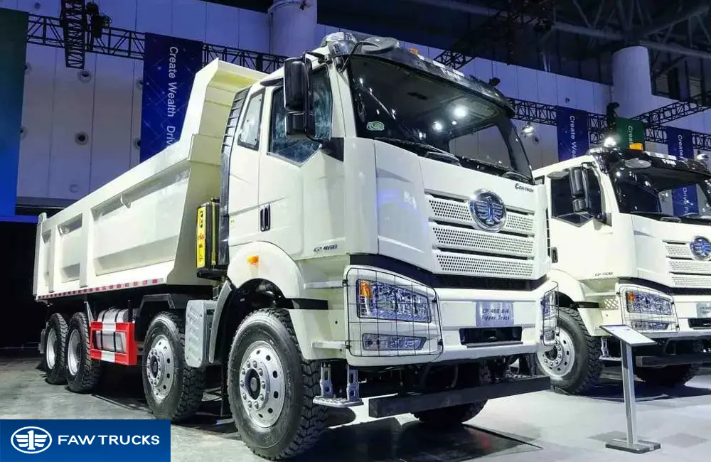 Front view of a white CORTRON dump truck with FAW logo, chrome grille and heavy-duty tipper configuration.