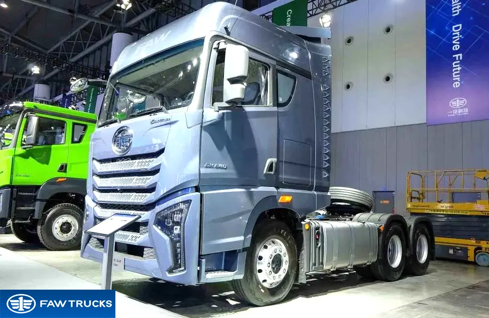 Grey DORTRON DH 640 6x4 tractor truck displayed at an exhibition, featuring FAW branding and a heavy-duty tractor configuration.