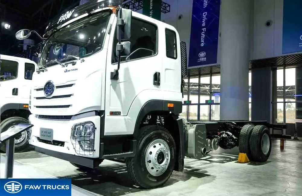 White DORTRON DK 320 4x2 cargo truck chassis displayed at an exhibition, featuring FAW branding and a heavy-duty cargo configuration.