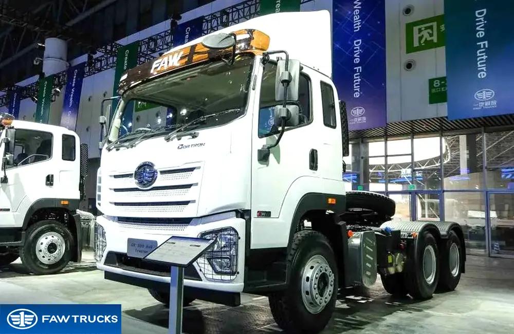 White DORTRON DK 320 6x4 tractor truck displayed at an exhibition, featuring FAW branding and a heavy-duty tractor configuration.