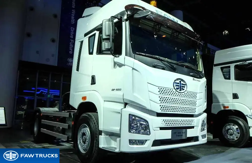 White DORTRON DP 420 4x2 tractor truck displayed at an exhibition, featuring FAW Jiefang branding and a 4x2 heavy-duty tractor configuration.