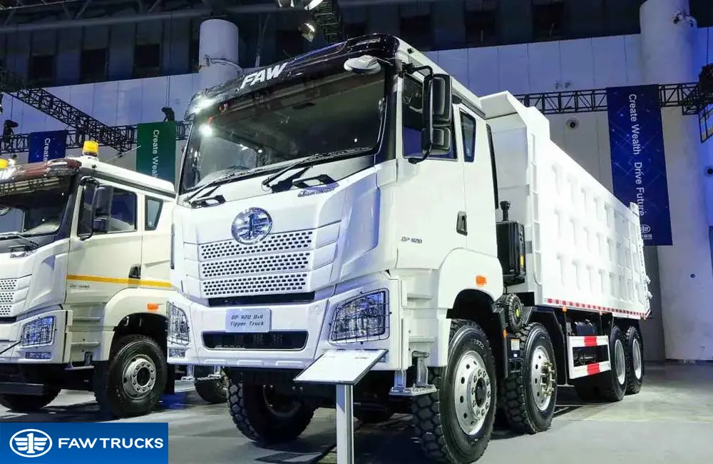 White DORTRON DP 420 8x4 dump truck displayed at an exhibition, featuring FAW branding and a heavy-duty tipper configuration.