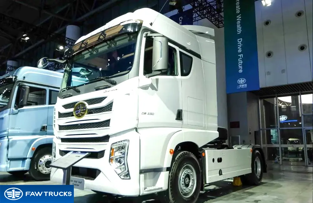 White DORTRON DS 350 4x2 tractor truck displayed at an exhibition, featuring FAW branding and a heavy-duty tractor configuration.