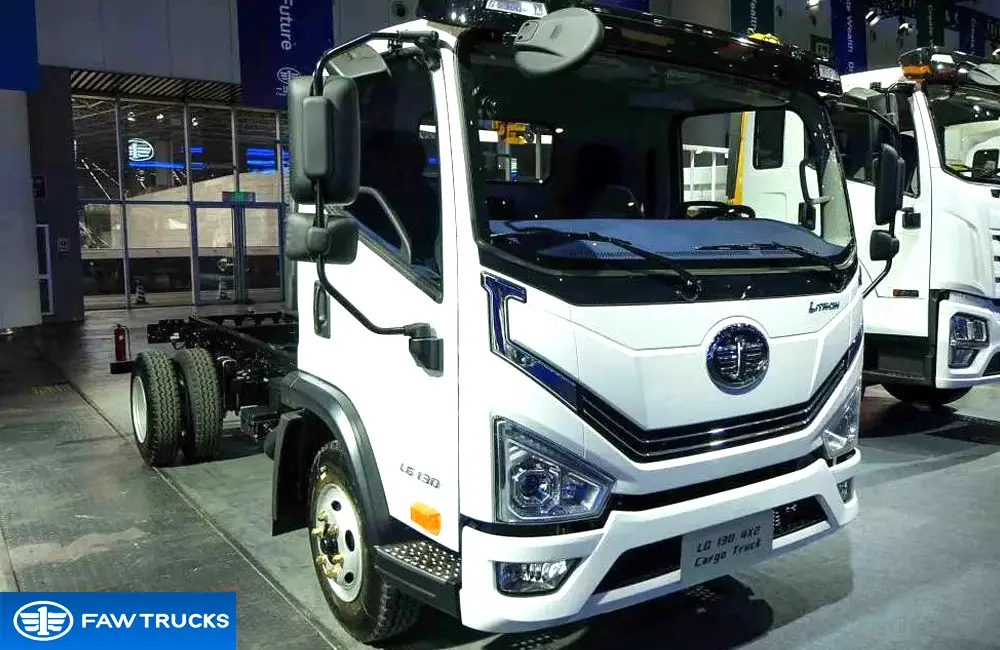 White DORTRON LG 130 4x2 cargo truck chassis displayed at an exhibition, featuring FAW branding and a light-duty cargo configuration.