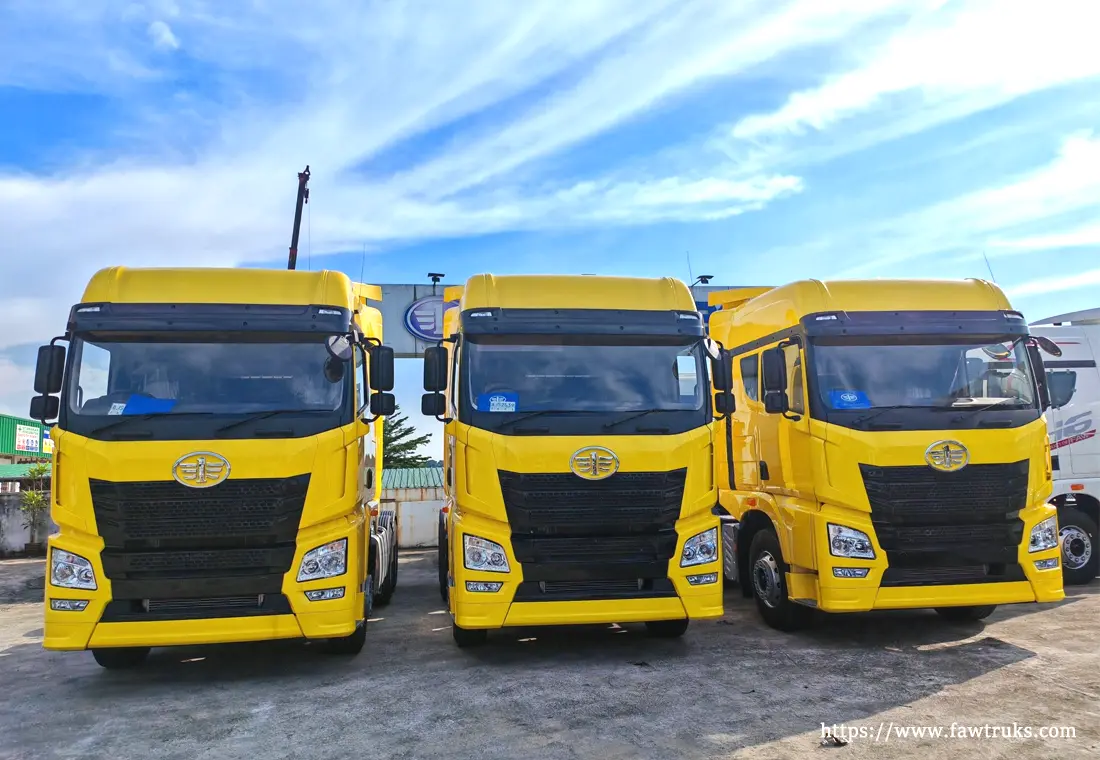 Yellow FAW tractor head trucks lined up for Saudi Arabia export