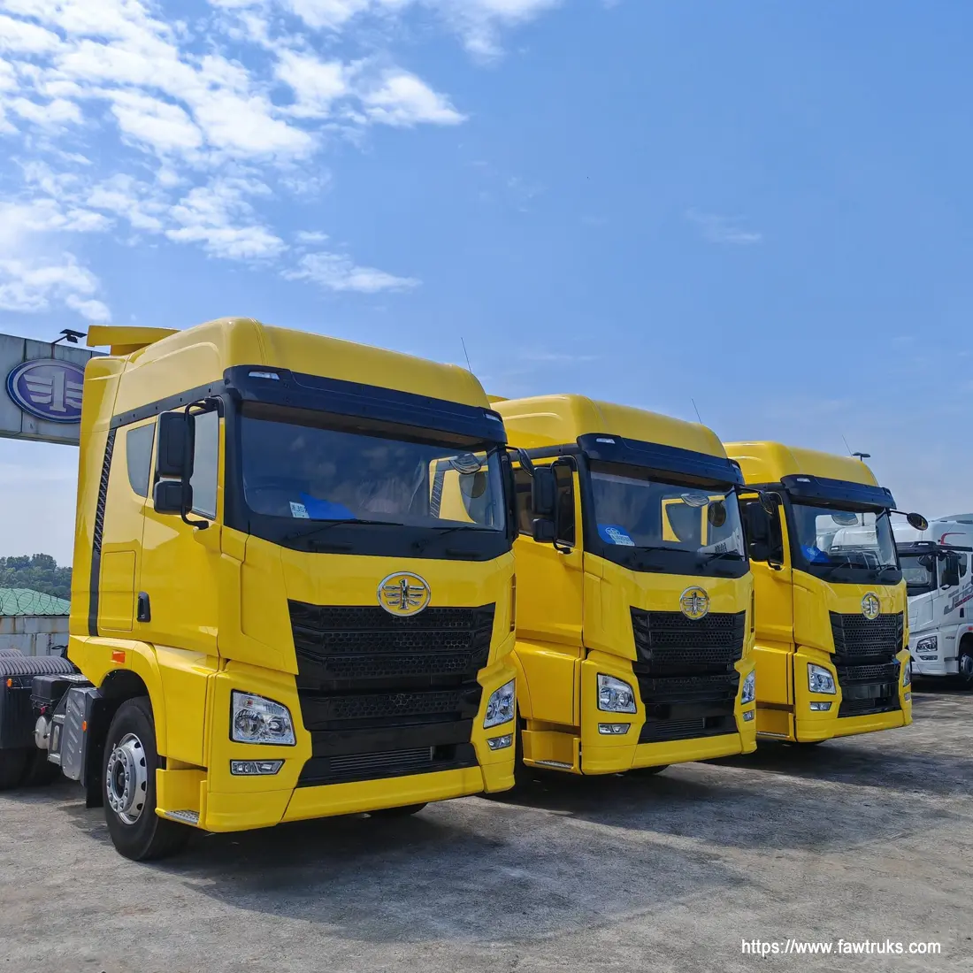 Yellow FAW tractor head trucks lined up for Saudi Arabia export